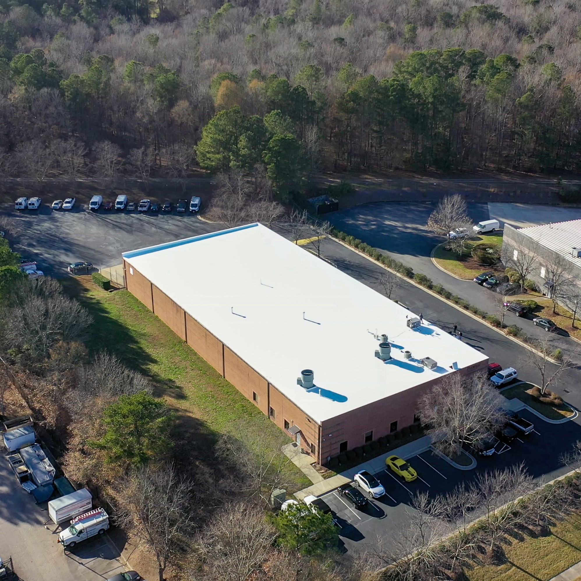 Overhead view of an office building with a fresh roof.